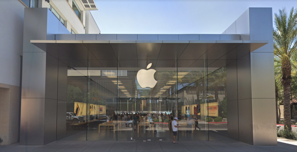 Image of an Apple Store entry with only one person outside of it.