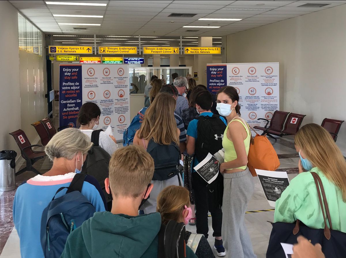 Passengers arriving on a flight from London Gatwick to the Greek island of Lemnos line up for immigration and random coronavirus testing in July 2020. (Photo: Mark Hodson / Flickr)