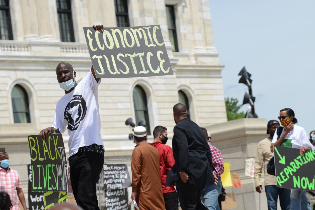 About 300 people gathered outside the Minnesota capitol building on June 19, 2020, to demand reparations from the United States government for years of slavery, segregation, redlining and violence against black people from police.
