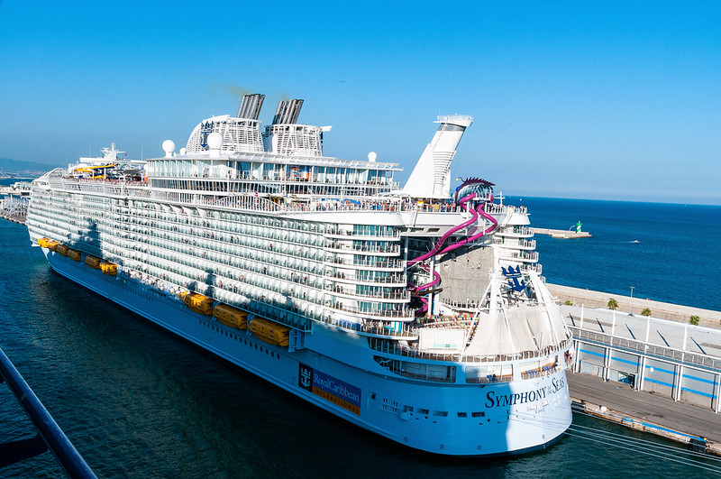 Royal Caribbean's Symphony of the Seas is seen docked in the Port of Barcelona on Sept, 23, 2018. After more than a year of restrictions, Spain is expected to reopen its ports to cruise ships on Monday. 