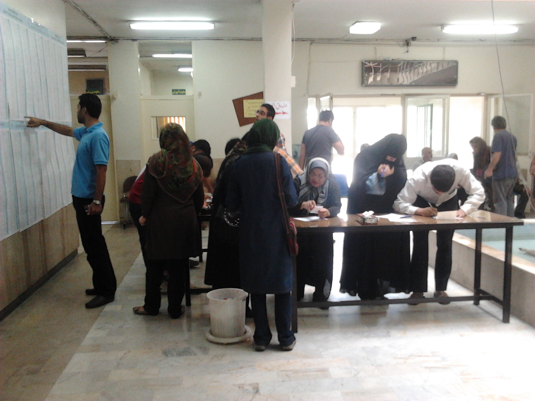 Iranians vote in a 2013 election.