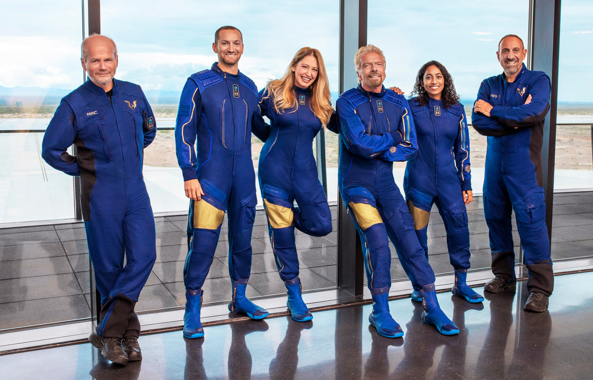 Billionaire Richard Branson (third from right) will join the crew of Virgin Galactic's latest test spaceflight on Sunday. (Photo: Virgin Galactic)