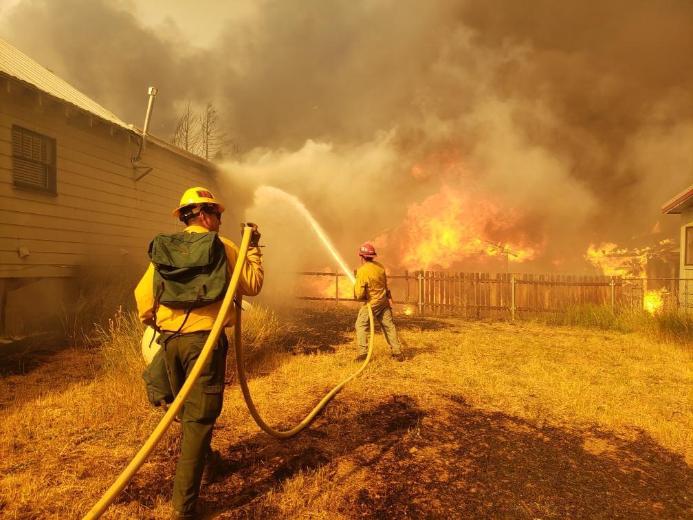 Firefighters worked to protect homes in Greenville, Calif., on Aug. 4 when extreme weather conditions resulted in aggressive fire behavior. (Photo: Lassen National Forest Service)