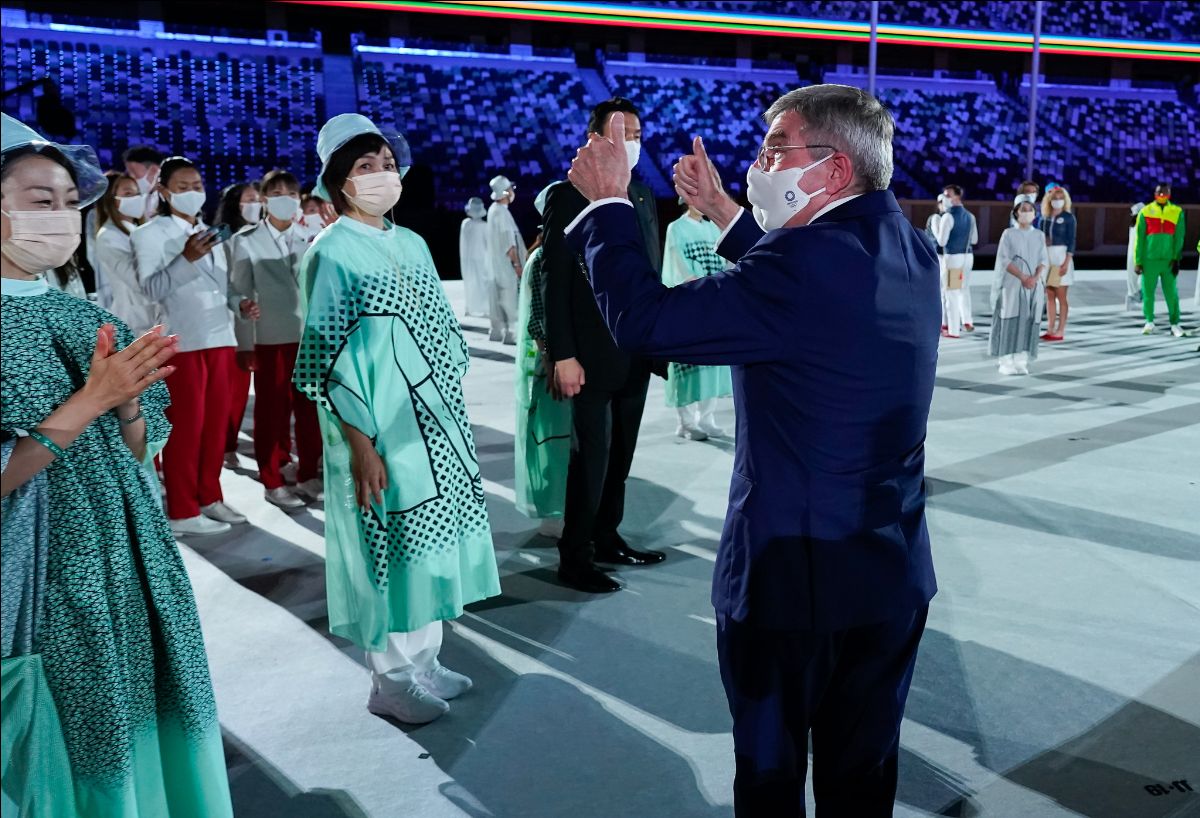 International Olympic Committee President Thomas Bach gives a thumbs-up to health care workers during the opening ceremony in Tokyo on July 23. (Photo: IOC / Greg Martin)