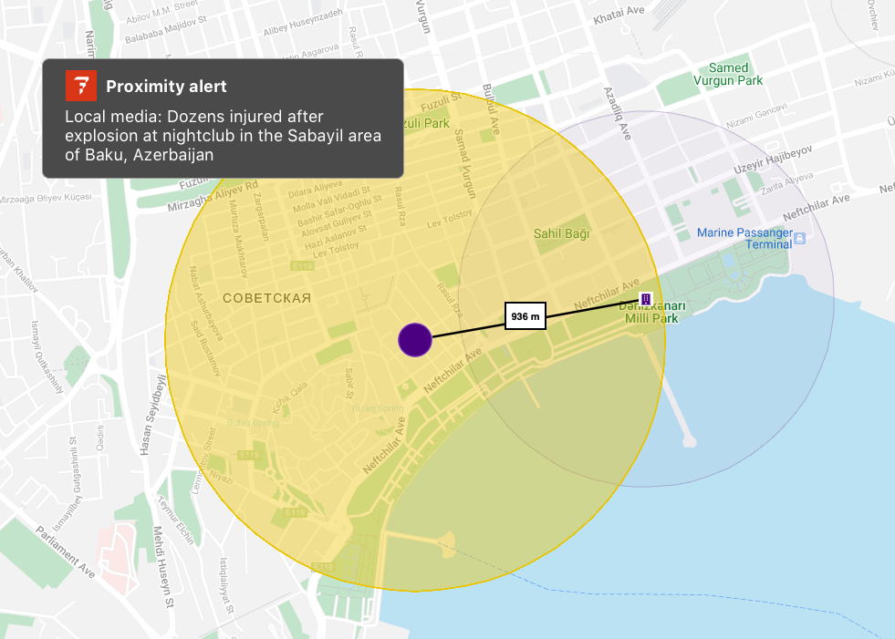 An example of a proximity alert in Baku, Azerbaijan. The image is of dock district in Baku. There is a purple square representing a location with a purple circle around it. The much larger yellow circle overlaps, showing the True Impact of the explosion from the proximity alert.
