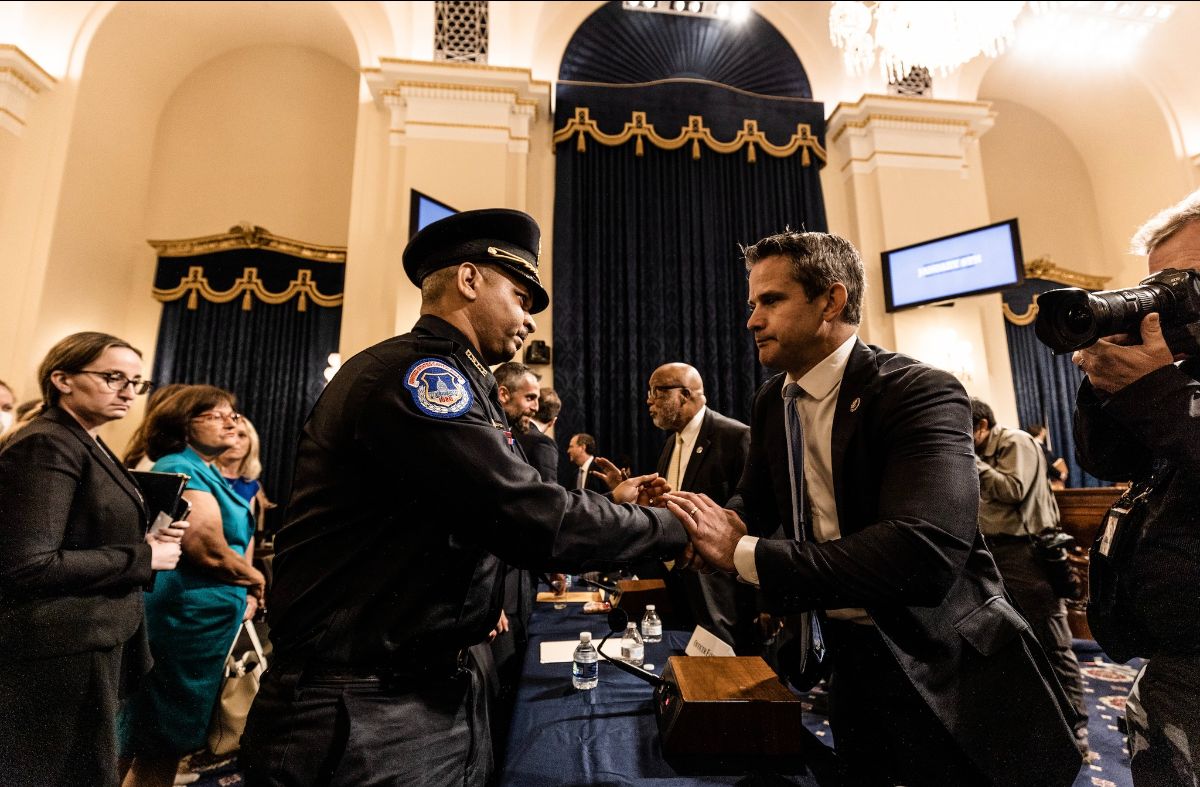 U.S. Rep Adam Kinzinger, R-Ill., (right) shakes hands with U.S. Capitol Police Officer Aquilino Gonell inside the U.S. capitol building