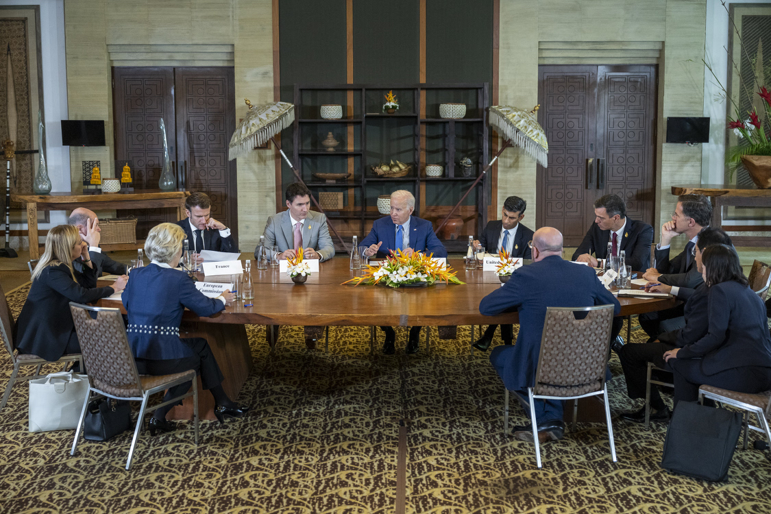 Leaders of the G20 sit at a large table.