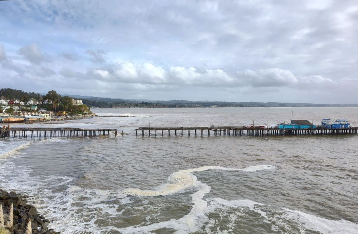 Portions of the Capitola Wharf in Santa Cruz California have fallen into the ocean. At the time of the photo it is mostly cloudy, the waves are typical. 