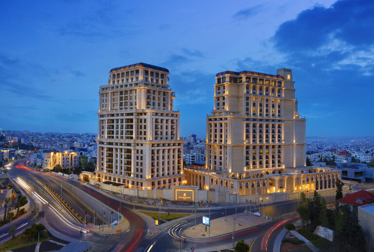 The exterior of the Ritz-Carlton in Amman, Jordan at night.