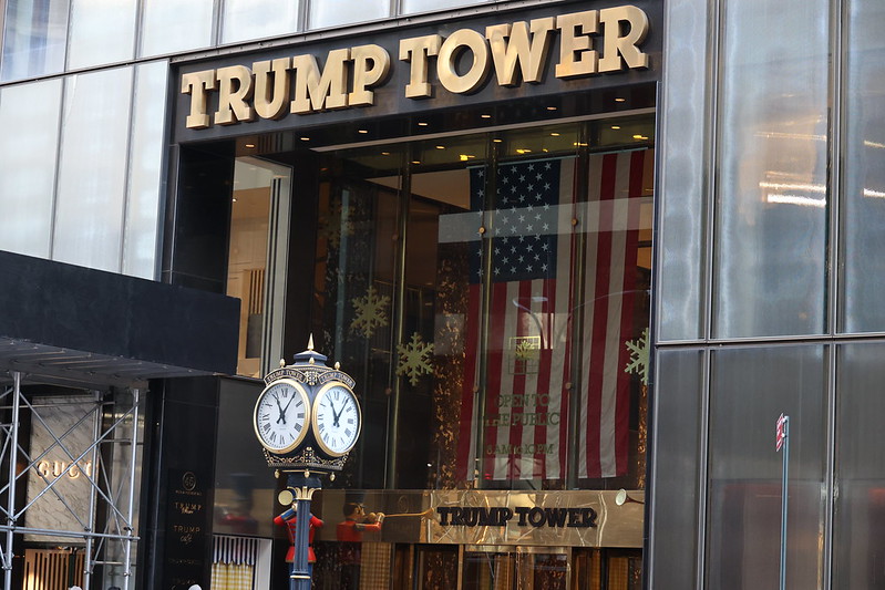 A street clock in front of the main entry to Trump Tower New York city.