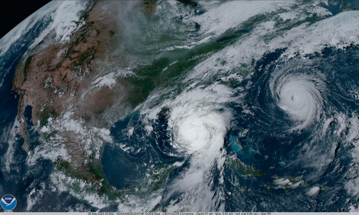 Satellite image of two hurricanes. One over the Atlantic Ocean east of the USA and the other over the Gulf of Mexico.