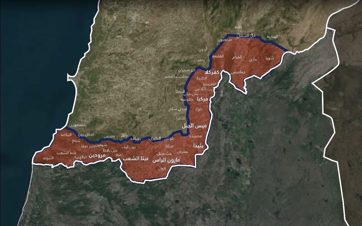 The image is a map highlighting a geographic area with a thick blue border that traverses through different regions. The area within the border is shaded in red. The surrounding land features various shades of green and brown, indicating different terrains. The adjacent body of water, likely a sea or ocean, is dark blue. Numerous Arabic names are spread throughout the shaded region, indicating towns or landmarks. The map provides a clear depiction of the delineated area in contrast to its surroundings.