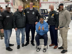 Venezuelan President Nicolás Maduro poses with DEA agents in New York following his capture by the United States. (Photo: U.S. Drug Enforcement Administration)